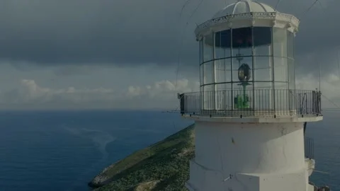 Remote island lighthouse close drone flyby Stock Footage 238366200