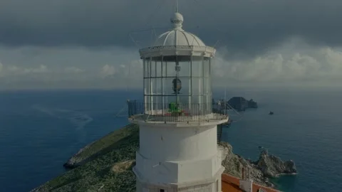 Remote island lighthouse close drone flyby Stock Footage 238366311
