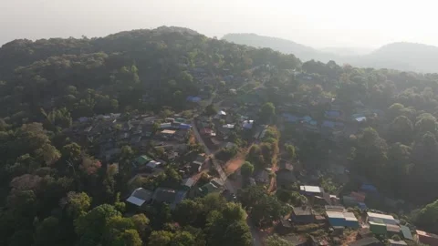 Remote jungle settlement with simple homes from above, Thailand Stock Footage 309114915