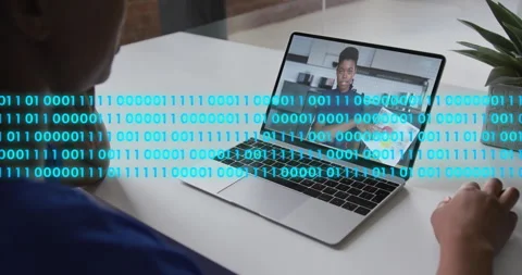 Remote learning student watching laptop color wheel lesson with floating code as Stock Footage 314348606