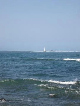 Remote Lighthouse by Rough Sea Stock Photos