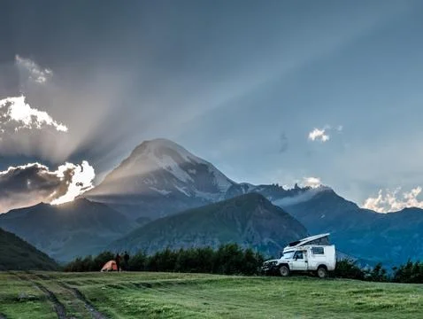Remote mountain camp at sunset Stock Photos