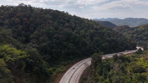 Remote Mountain Pass Road with Distant Peaks Stock Footage 327506964