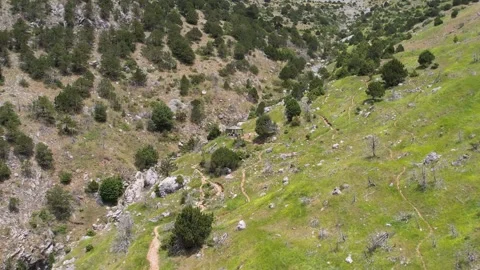 Remote Mountain Trail Leading to a Rest Stop Over a Ravine Stock Footage 303421062