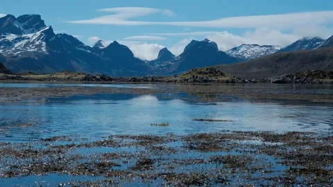 Remote mountains, rocks, clouds, snow and glacier. Dream like a typical Stock Footage 109233214