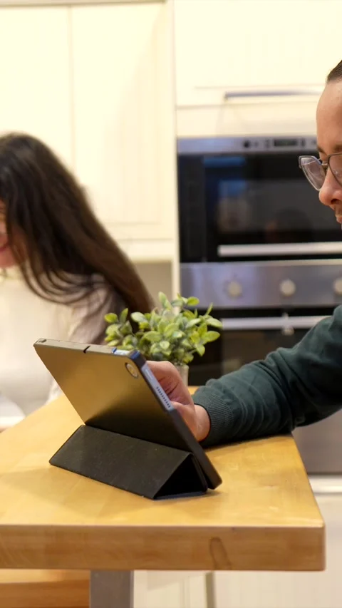 Remote professional multitasking on phone and tablet at home Stock Footage 334134277