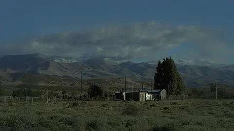 Remote Rural House Surrounded By Mountain Landscape Video stock 332246036