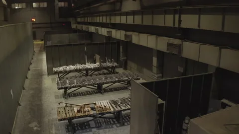Remote section of hall shows storage with damaged scaffolding Stock-Footage 303112472