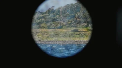 Remote Shore Seen Through Ship Porthole at Sea Stock Footage 331940132