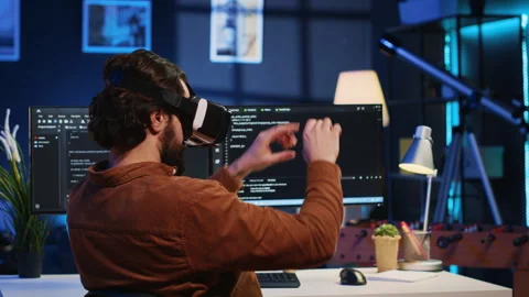 Remote software developer using VR goggles in personal office at home Stock Footage 265622461