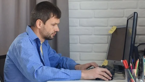 The remote specialist works at home at the computer Stock-Footage 126872706