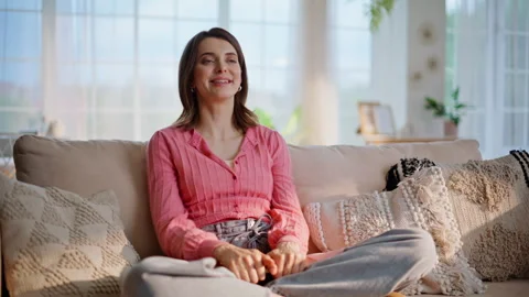 Remote student closing laptop sitting cross-legged at comfortable couch room. Stock Footage 332846738