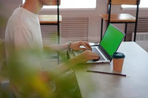 Remote study with a young student with his hands working on a laptop keyboa.. Foto stock