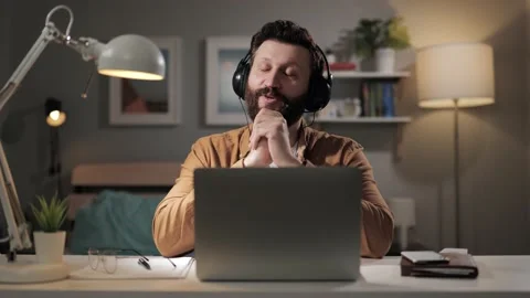 Remote support man talking on headset. Ironic online store consultant talking on 库存影片 188740797