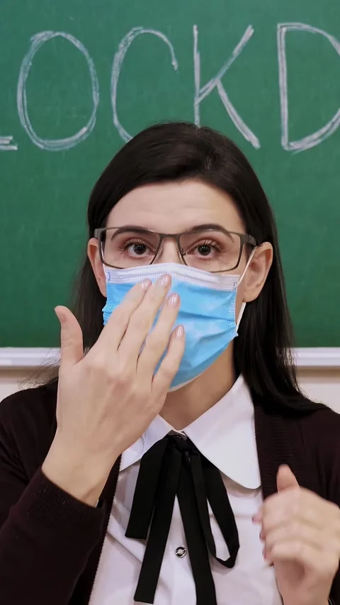 Remote teaching, lockdown at schools. Teacher shows and explains to students the Stock Footage 317850091