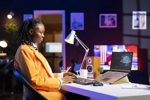 Remote tech support specialist working from home, doing checkup on AI systems Foto stock