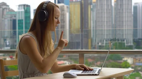 Remote techer has a conversation with a student through the internet at a Stock Footage 100100530