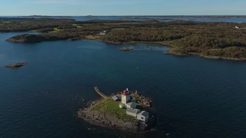Remote Tyrhaug Lighthouse captured in aerial flight over Smola, Norway Stock Footage 320500070