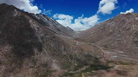 Remote Valley Road Between Rocky Hills Drone view Stock Footage 311046188