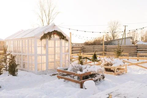 Remote view facade of cozy summer house snow-covered, windows frozen and covered Stock Photos