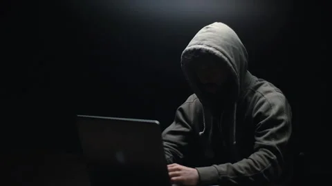 Remote view of unrecognizable hacker man stretching hands and starting to typing Stock Footage 145121901