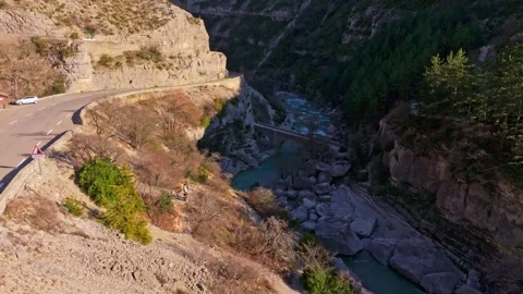 Remote waterfall flows in quiet valley of southern France Stock Footage 307313695