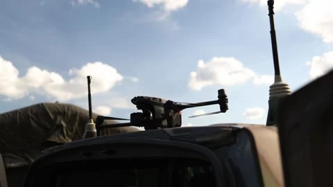 Remote weapon station and targeting equipment mounted on military vehicle Stock Footage 346451865