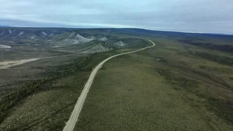 Remote Wilderness Road through Boreal Tundra, Aerial View Stock Footage 289486173