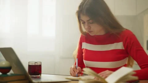 Remote work allows a woman to work at home on a laptop. Stock Footage 273573436
