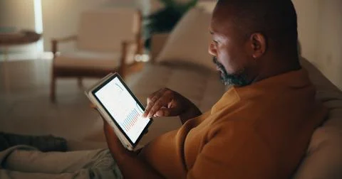 Remote work, analysis or black man in home with tablet screen, forecasting .. Stock Photos