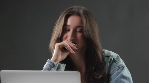 Remote work and digital nomad lifestyle, young woman working on laptop in studio Stock Footage 337005143
