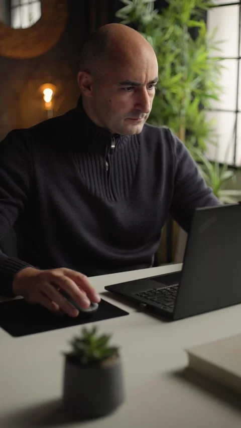 Remote work and digital nomad lifestyle, man typing on laptop in home office Stock Footage 344144442