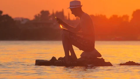 Remote work background. Internet connection 3G 4G. Man with notebook on seashore Stock Footage 113759333