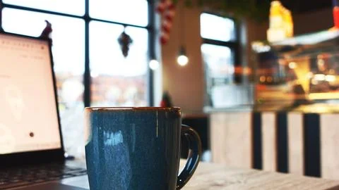 Remote Work Coffee Break in a Warm Café Atmosphere Stock Photos
