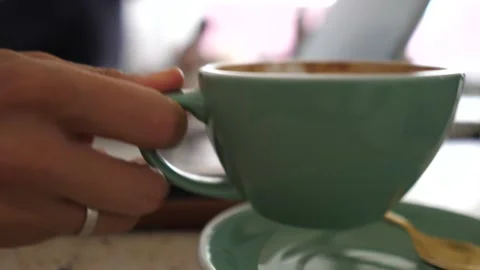 Remote work concept. Close up of female hands typing on a laptop and drinking Video stock 150807316