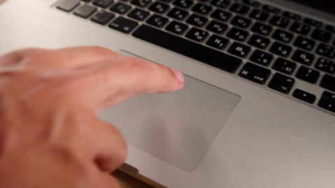 Remote work concept. Person browsing the internet with a trackpad. Man usin.. Stock Footage 340958832
