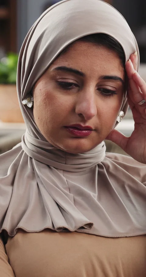 Remote work, headache and Muslim woman on sofa with stress for thinking, mistake Stock Footage 329400322