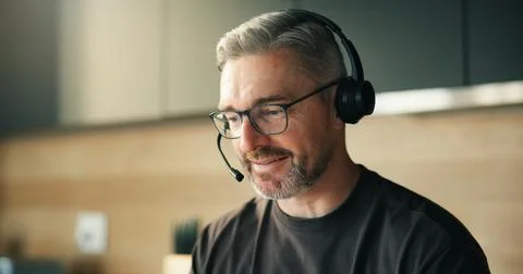 Remote work, headset and man in home for telemarketing, outbound call and l.. Stock Photos