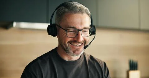 Remote work, headset and mature man in home for telemarketing, outbound cal.. Stock Photos
