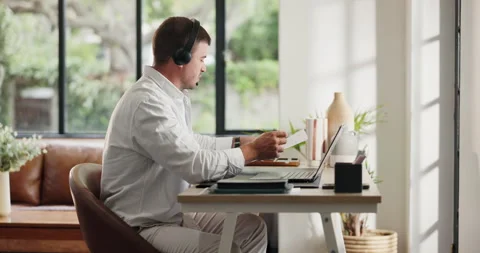 Remote work from home, headphones and man with laptop, documents for article Stock Footage 329402863