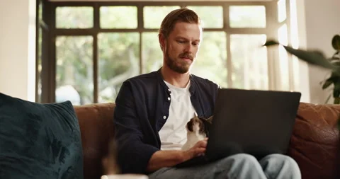 Remote work from home, thinking and man with cat, laptop and problem solving Stock Footage 310496294