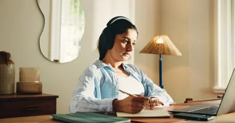 Remote work from home, writing and woman with laptop, headphones and notes .. 스톡 사진