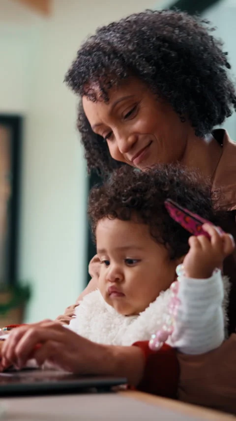 Remote work, love and mom with baby on laptop for research, online project and Stock Footage 335892429