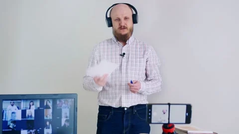 Remote work in the office, the boss conducts a meeting at home. A bald man with Video stock 154338687