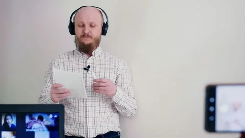 Remote work in the office, the boss explains the work plan for the day. A bald Stock Footage 154295660