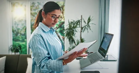 Remote work, paperwork and woman on walking pad for copywriting, editing and Stock Footage 330165339