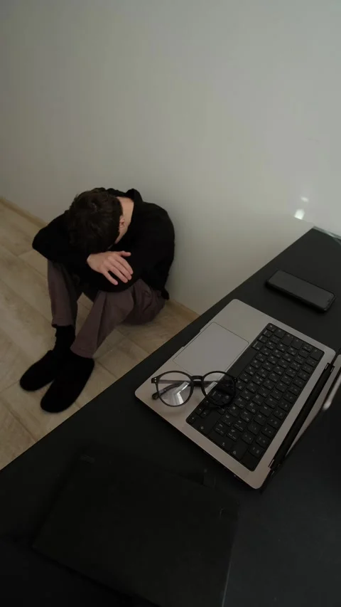 Remote work problems, man sitting on floor with head down in home office Stock Footage 329626517