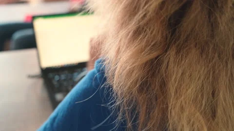 Remote work. Rear view on working with a laptop woman 動画素材 134818945