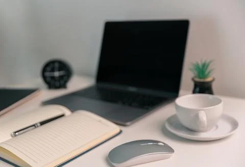 Remote work relies on technology, with employees using laptops and computer.. Stock Photos