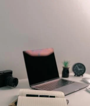 Remote work relies on technology, with employees using laptops and computer.. Stock Photos